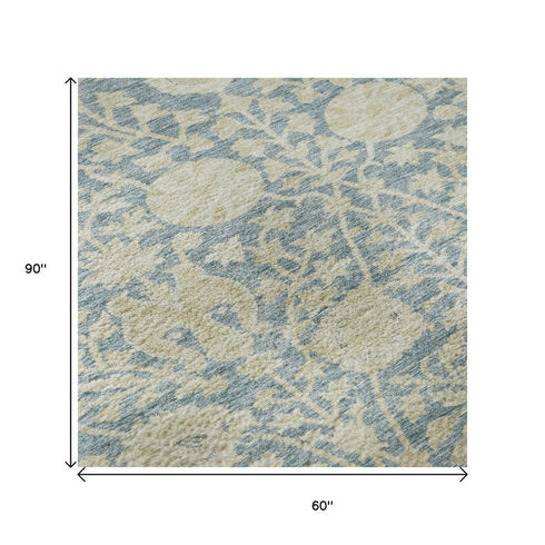 5' X 8' Sky Blue And Ivory Floral Washable Area Rug With UV Protection