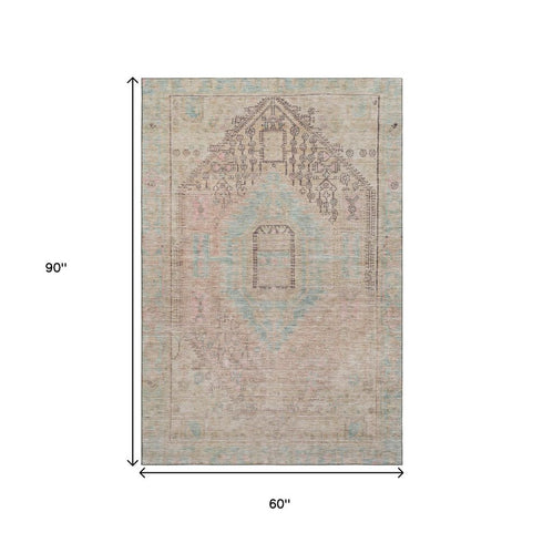 5' X 8' Pink Beige And Teal Tribal Washable Area Rug With UV Protection