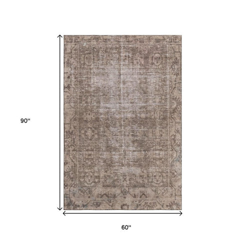 5' X 8' Brown Beige And Taupe Oriental Washable Area Rug With UV Protection