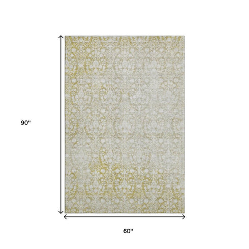 5' X 8' Gold And Ivory Damask Washable Area Rug With UV Protection