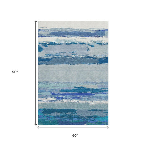 5' X 8' Blue And Ivory Abstract Washable Area Rug With UV Protection