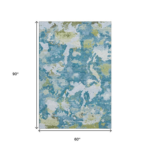 5' X 8' Denim Blue Ivory And Green Abstract Washable Area Rug With UV Protection