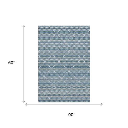 5' X 8' Denim Blue Ivory And Teal Geometric Washable Area Rug With UV Protection