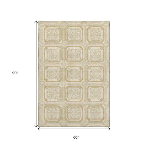 5' X 8' Gold And Ivory Geometric Washable Area Rug With UV Protection