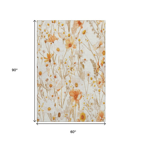 5' X 8' Ivory And Orange Floral Washable Area Rug With UV Protection