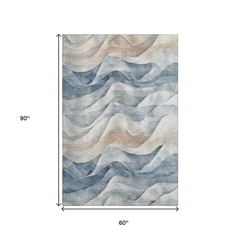 5' X 8' Blue Beige And Ivory Abstract Washable Area Rug With UV Protection