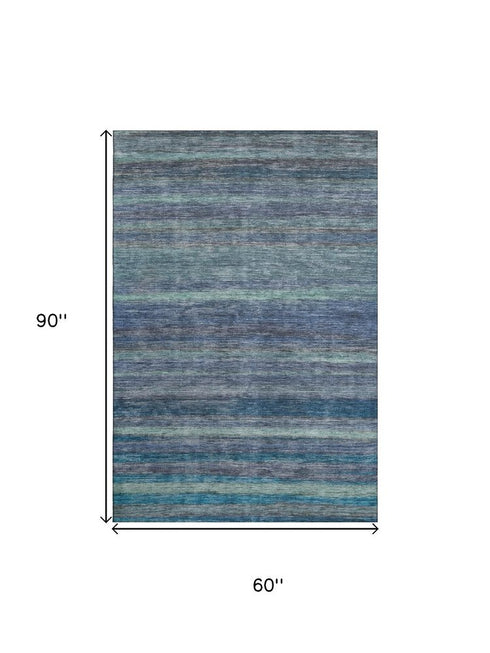 5' X 8' Blue Teal And Gray Striped Washable Area Rug With UV Protection
