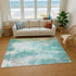 9' X 12' Teal Peach And Ivory Abstract Washable Area Rug With UV Protection