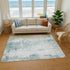 8' X 10' Turquoise And Ivory Abstract Washable Area Rug With UV Protection