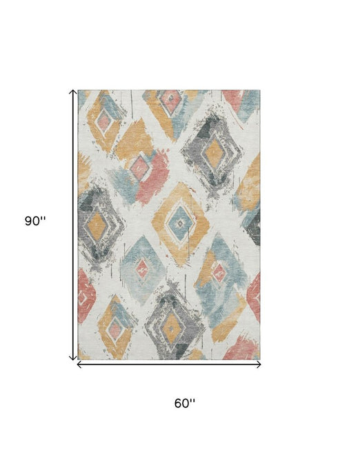 5' X 8' Ivory Gold And Blush Abstract Geometric Washable Area Rug With UV Protection
