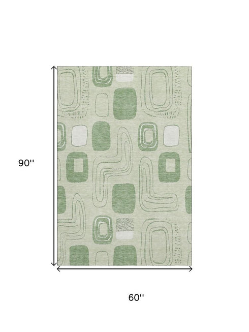 5' X 8' Mint Green And Ivory Geometric Washable Area Rug With UV Protection