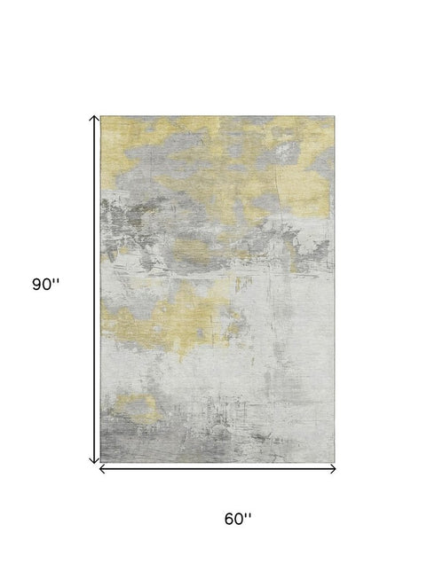 5' X 8' Gold Gray And Ivory Abstract Washable Area Rug With UV Protection