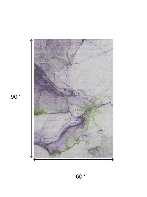 5' X 8' Purple Green And Ivory Abstract Washable Area Rug With UV Protection