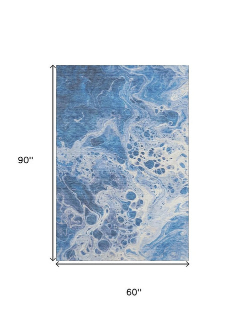 5' X 8' Navy Blue And Ivory Abstract Washable Area Rug With UV Protection