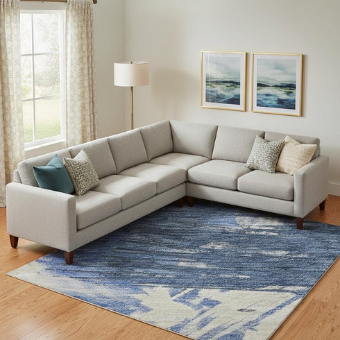 9' X 12' Navy Blue Green And Ivory Abstract Washable Area Rug With UV Protection
