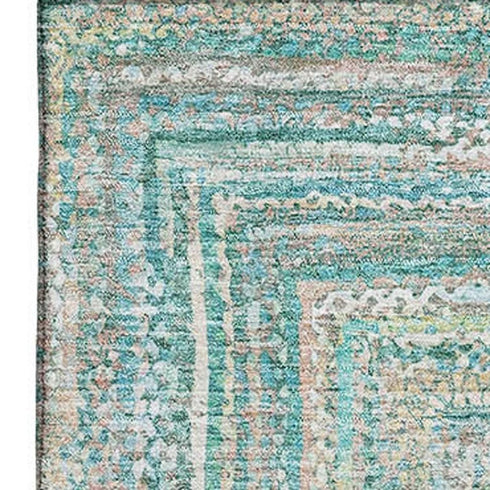 8' X 10' Teal And Ivory Geometric Washable Area Rug With UV Protection