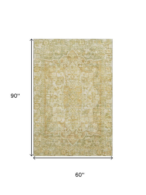 5' X 8' Tan Gold And Ivory Oriental Washable Area Rug With UV Protection