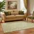 5' X 8' Tan Gold And Ivory Oriental Washable Area Rug With UV Protection