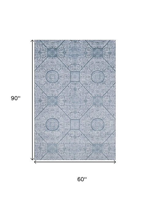 5' X 8' Blue And Ivory Geometric Washable Area Rug With UV Protection