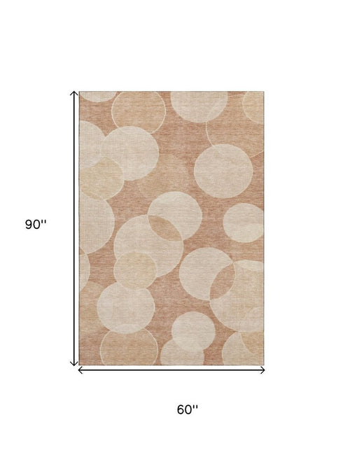 5' X 8' Coral And Peach Geometric Washable Area Rug With UV Protection