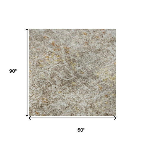 5' X 8' Brown Gold And Orange Oriental Washable Area Rug With UV Protection