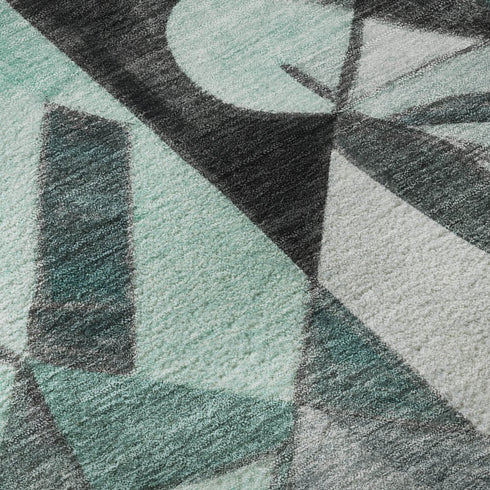 5' X 8' Teal Black And Ivory Abstract Washable Area Rug With UV Protection