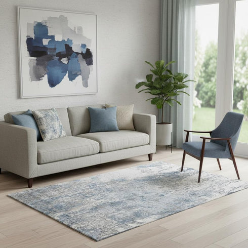 5' X 8' Blue And Ivory Abstract Washable Area Rug With UV Protection