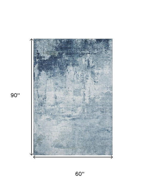 5' X 8' Blue And Ivory Abstract Washable Area Rug With UV Protection