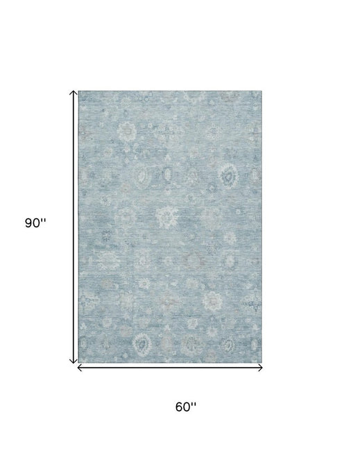 5' X 8' Blue And Ivory Damask Washable Area Rug With UV Protection