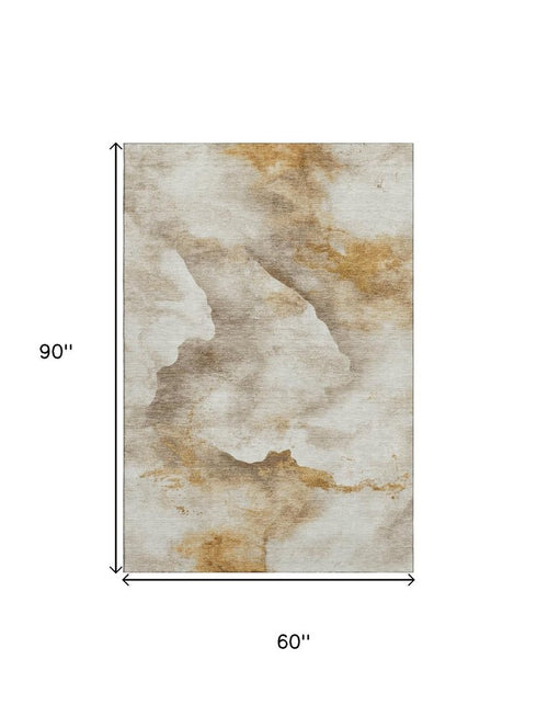 5' X 8' Beige Gold And Ivory Abstract Washable Area Rug With UV Protection