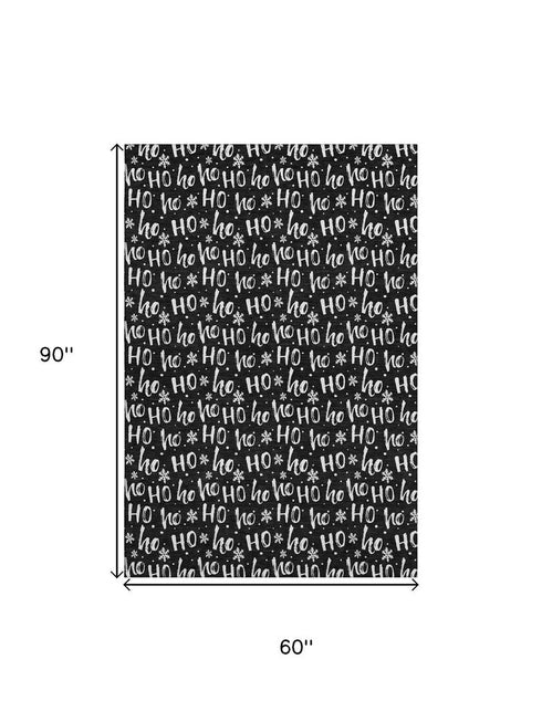 5' X 8' Black And Ivory Abstract Geometric Washable Area Rug With UV Protection