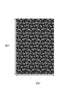 5' X 8' Black And Ivory Abstract Geometric Washable Area Rug With UV Protection