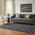 5' X 8' Black And Ivory Abstract Geometric Washable Area Rug With UV Protection