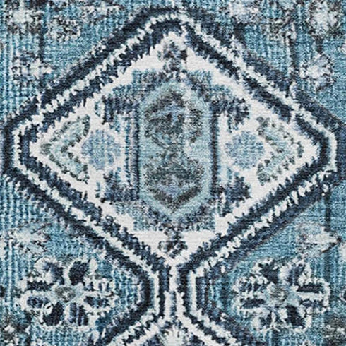 5' X 8' Blue And Ivory Geometric Washable Area Rug With UV Protection