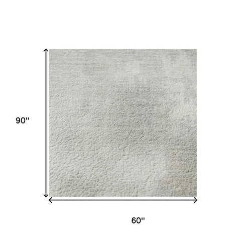 5' X 8' Ivory And Beige Abstract Washable Area Rug With UV Protection