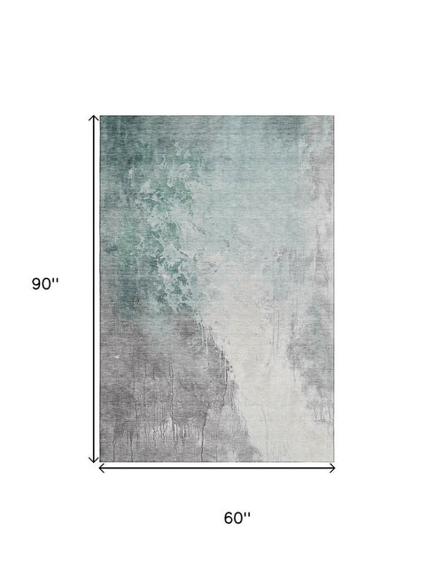 5' X 8' Pale Aqua And Ivory Abstract Washable Area Rug With UV Protection