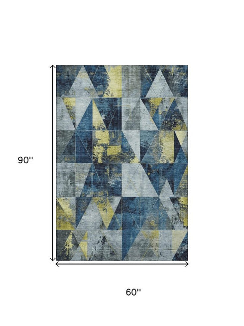 5' X 8' Navy Blue And Gold Geometric Washable Area Rug With UV Protection