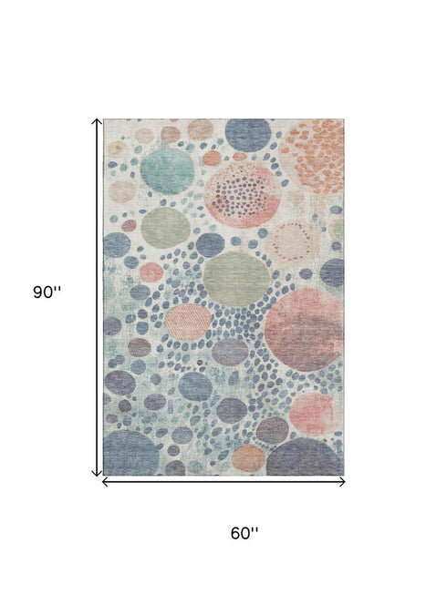 5' X 8' Denim Blue Peach And Ivory Geometric Washable Area Rug With UV Protection