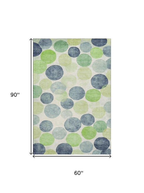 5' X 8' Navy Blue Green And Ivory Geometric Washable Area Rug With UV Protection