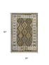 5' X 8' Brown And Ivory Tribal Washable Area Rug With UV Protection