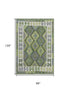 8' X 10' Olive Green And Ivory Tribal Washable Area Rug With UV Protection