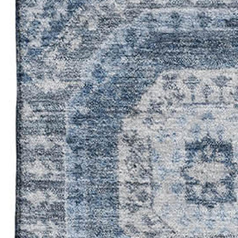 5' X 8' Blue And Ivory Abstract Geometric Washable Area Rug With UV Protection