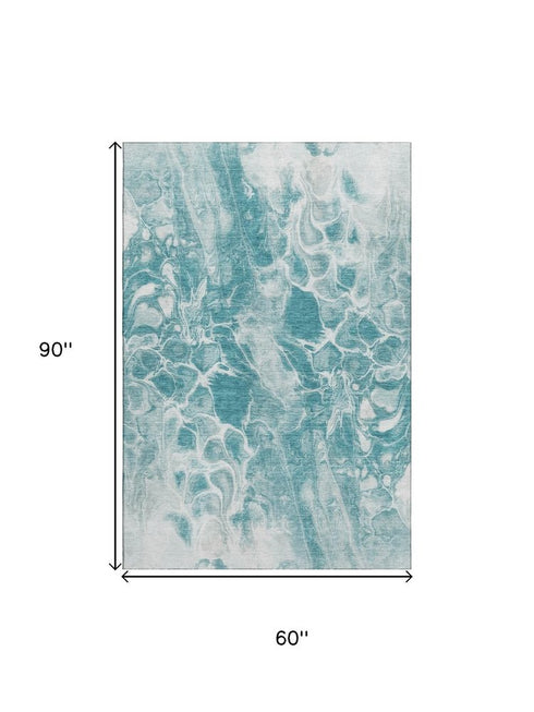 5' X 8' Teal And Ivory Abstract Washable Area Rug With UV Protection
