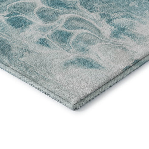 5' X 8' Teal And Ivory Abstract Washable Area Rug With UV Protection