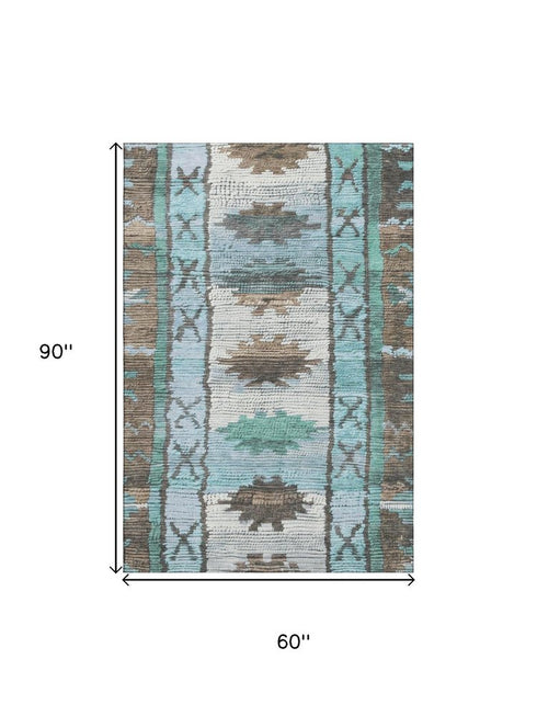 5' X 8' Brown Teal And Ivory Tribal Washable Area Rug With UV Protection