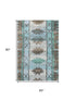 5' X 8' Brown Teal And Ivory Tribal Washable Area Rug With UV Protection