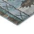 5' X 8' Brown Teal And Ivory Tribal Washable Area Rug With UV Protection