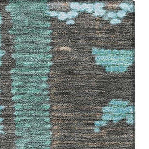 5' X 8' Brown Teal And Ivory Tribal Washable Area Rug With UV Protection