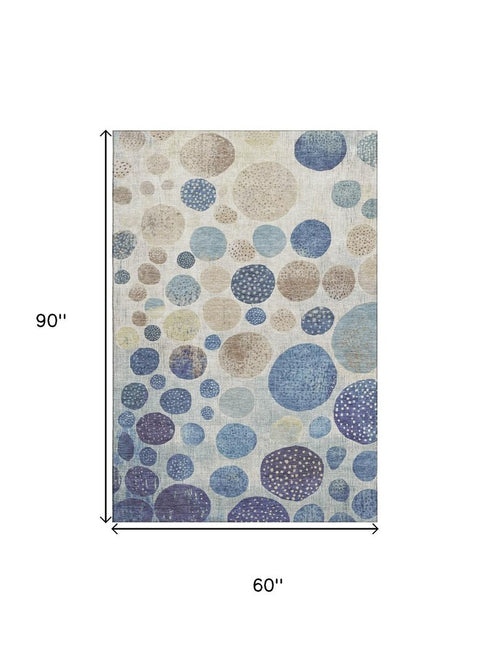 5' X 8' Navy Blue Ivory And Taupe Geometric Washable Area Rug With UV Protection