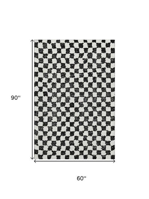 5' X 8' Black And Ivory Geometric Washable Area Rug With UV Protection